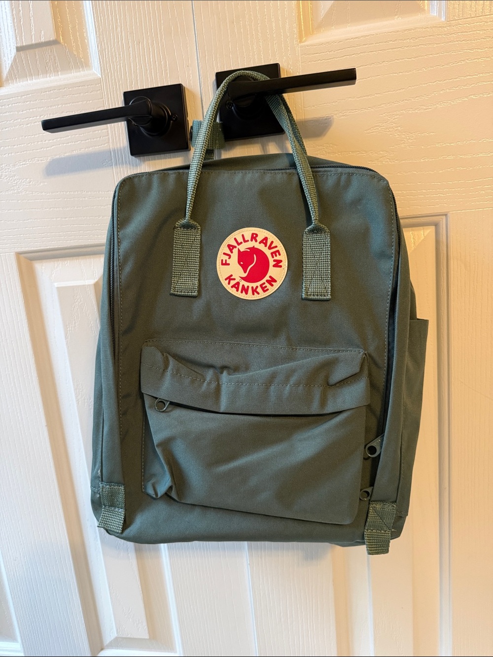 Fjallraven Kanken Backpack in Olive Green with Red Logo